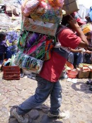 indigenous man carrying stuff on head guatemala-chichicastenango 031
